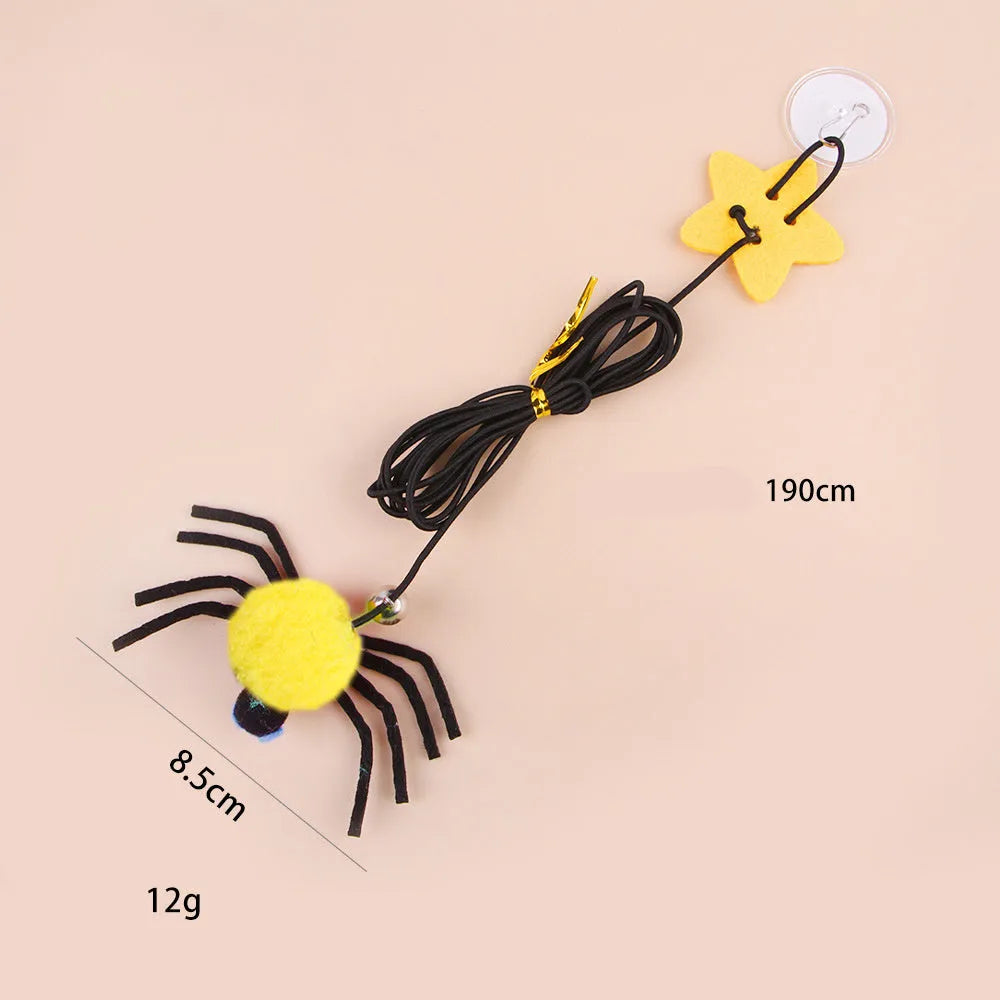 Cat hanging door toy with elastic rope, feather, bell and spider attachment in red colour