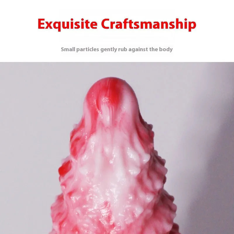 Pink platinum silicone shaped penis women's masturbation device on a plain background.