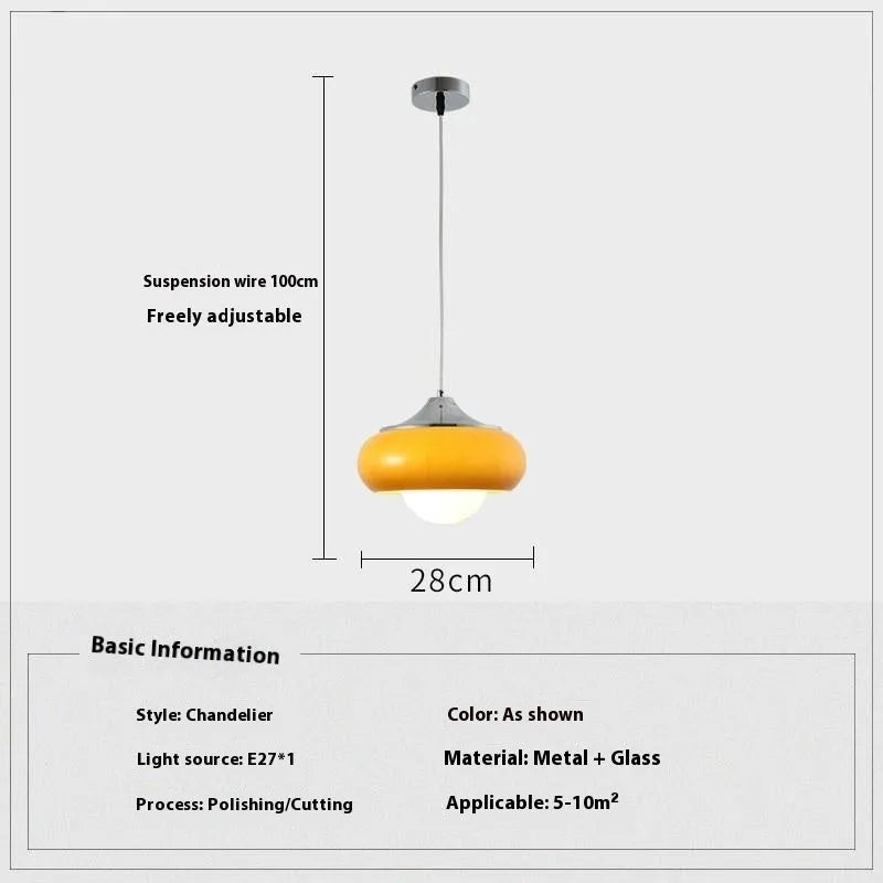 Three-headed Bauhaus pendant light with milky white glass egg tart shades hanging from a ceiling.