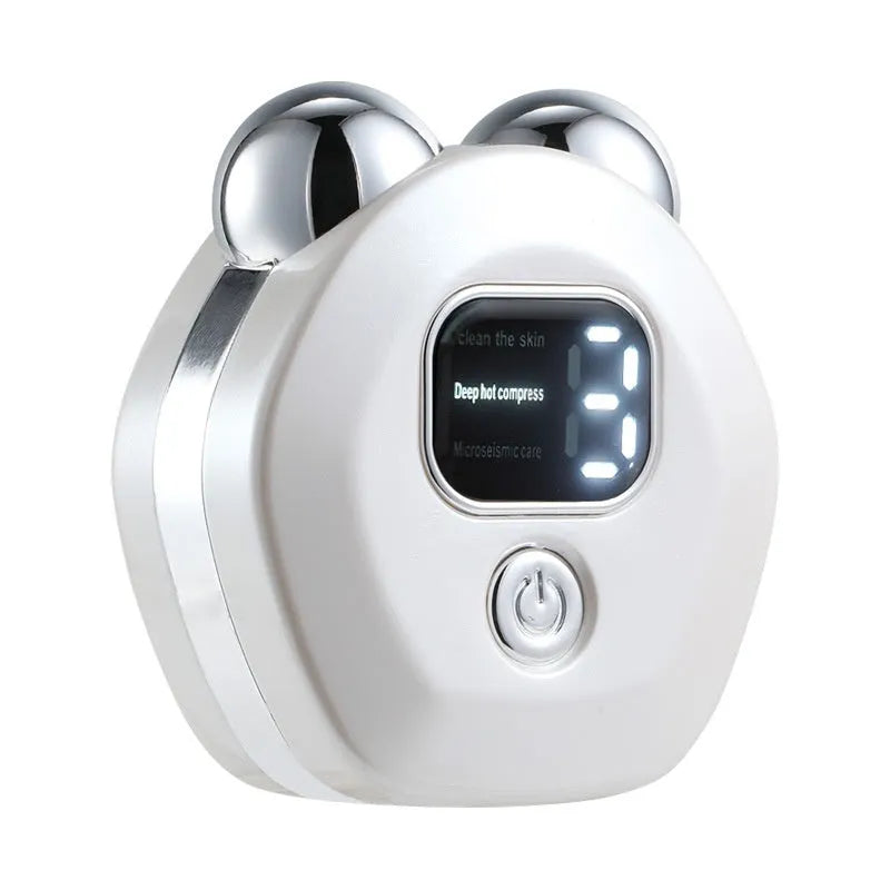 Portable white facial massage instrument with a dual-roller head for hot compress and microcurrent therapy.