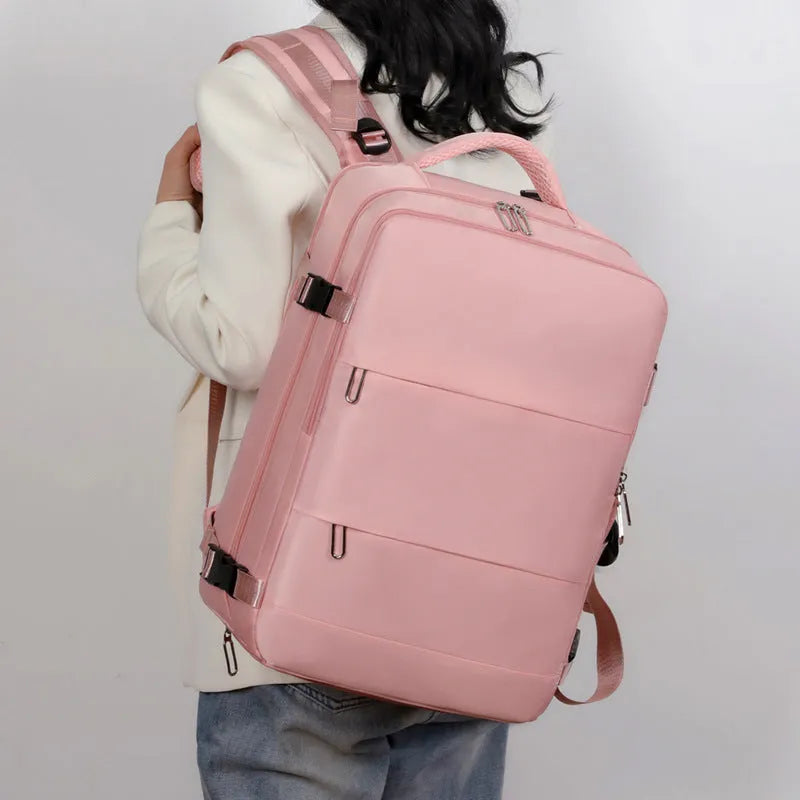 Large purple Oxford cloth travel backpack with multiple compartments and an air pillow belt on the straps.