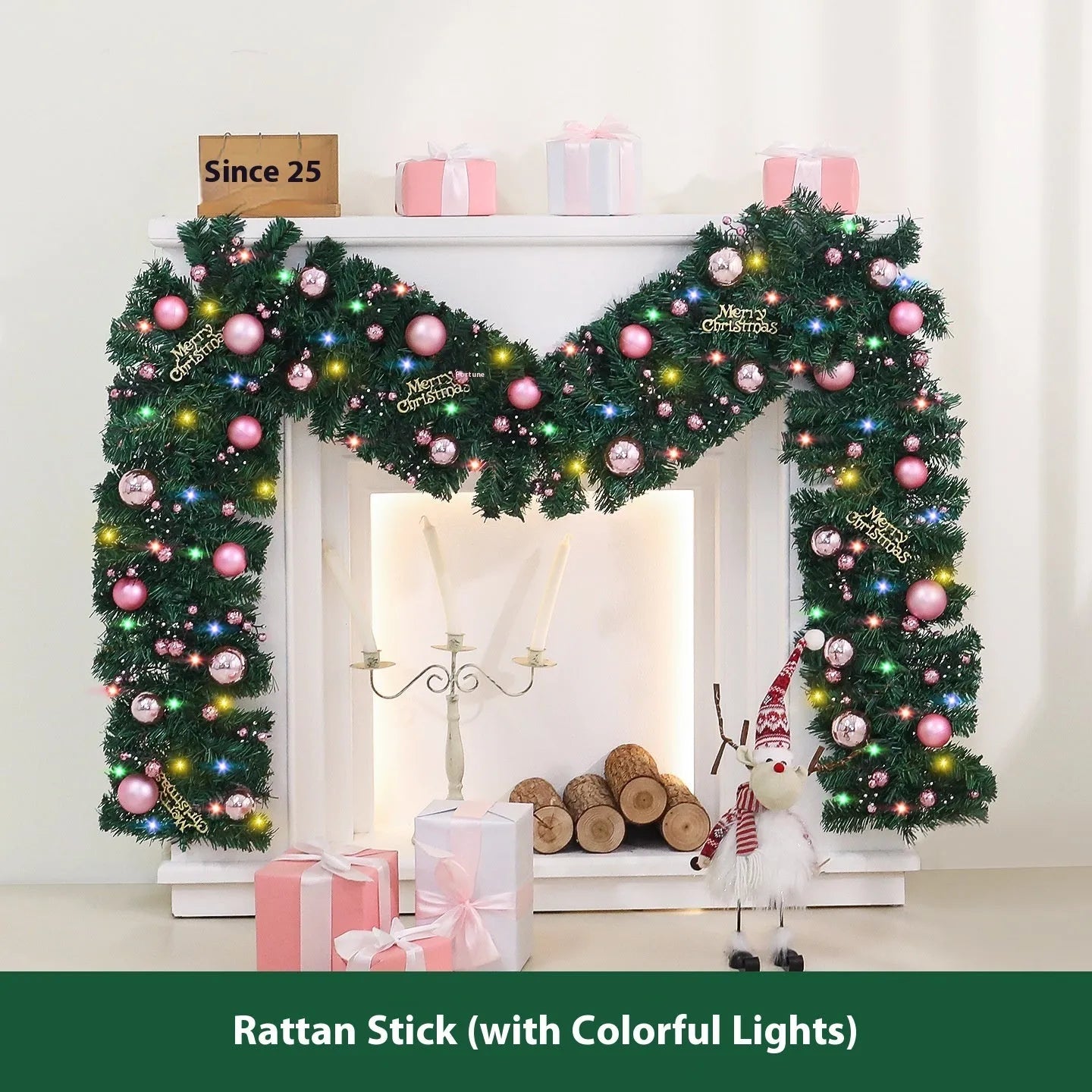 Long pink rattan Christmas garland with small fruit details and optional warm white lights draped on a mantle.