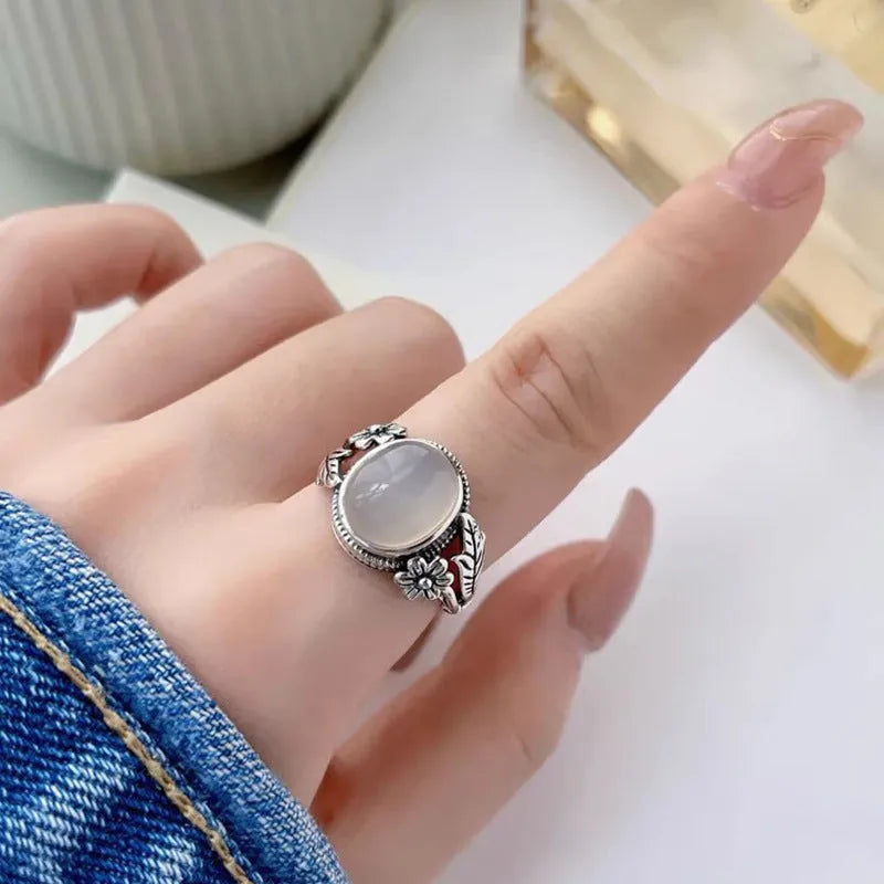Adjustable vintage-style copper ring with white chalcedony finish showing open mouth design