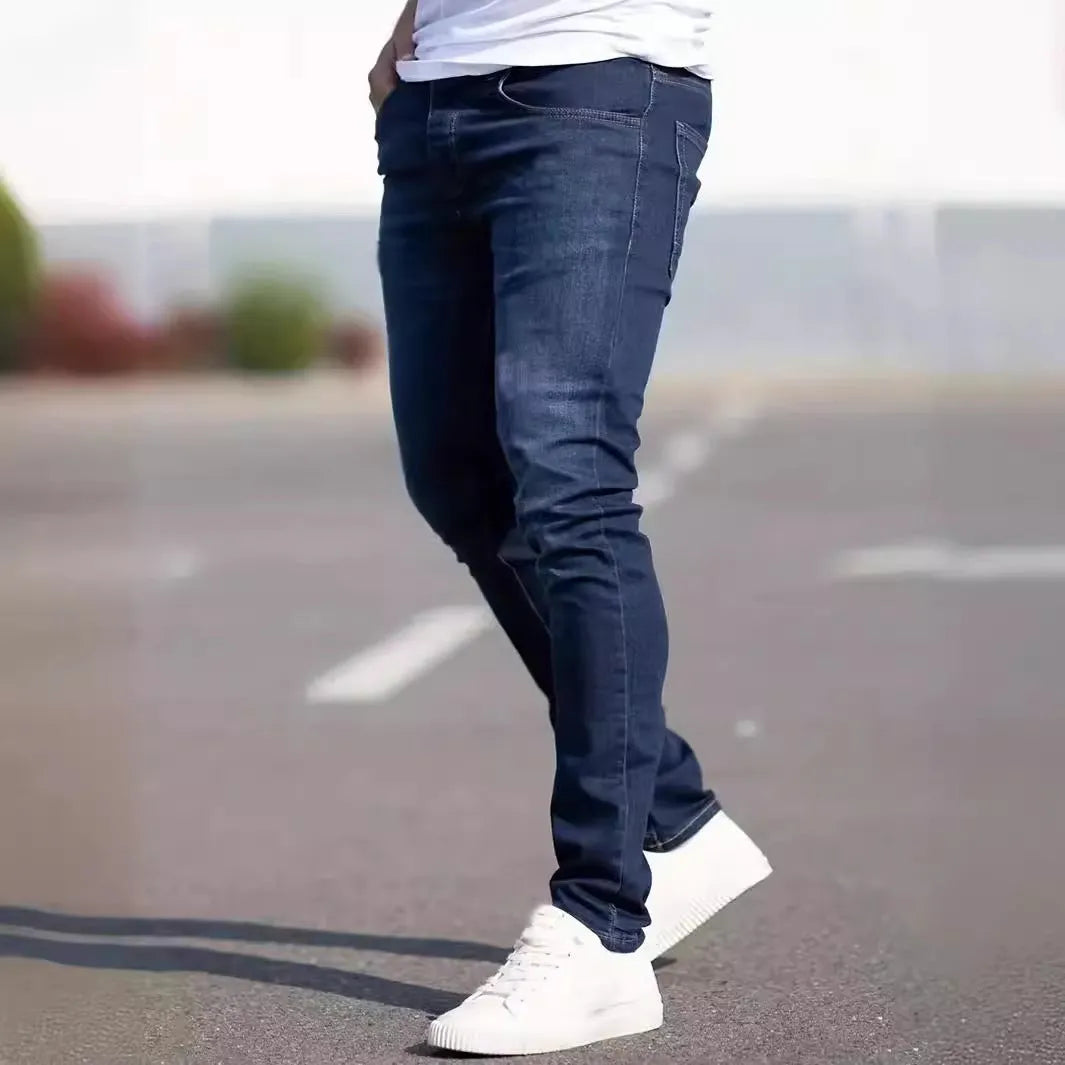 Men's dark blue slim casual jeans with skinny leg style and mid-waist cut