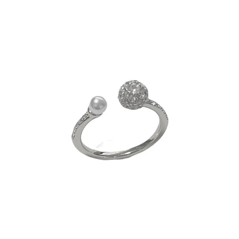 Gold plated open-end ring with round zircon accents on a geometric copper band