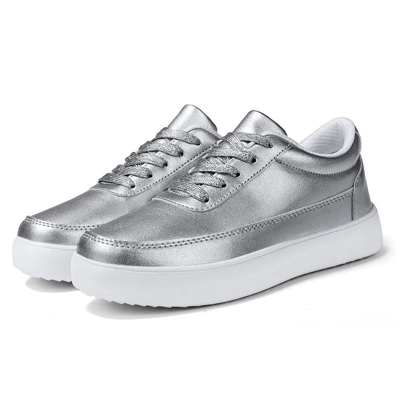 Women's white leather casual flat lace-up shoes on a light background, showing the front and side profile.