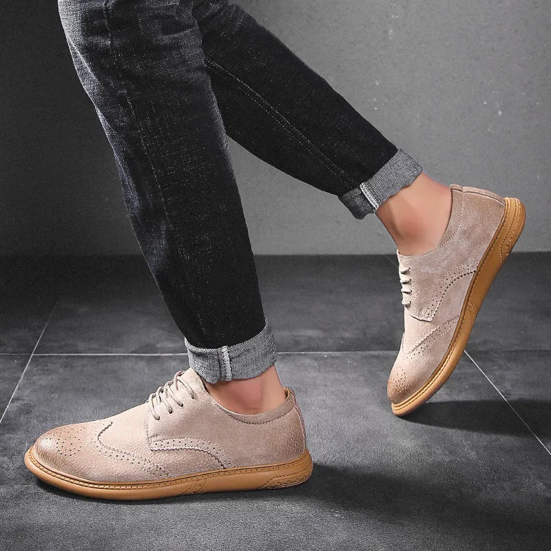 Men's grey low-top leather business shoes with lace-up design and non-slip rubber sole.