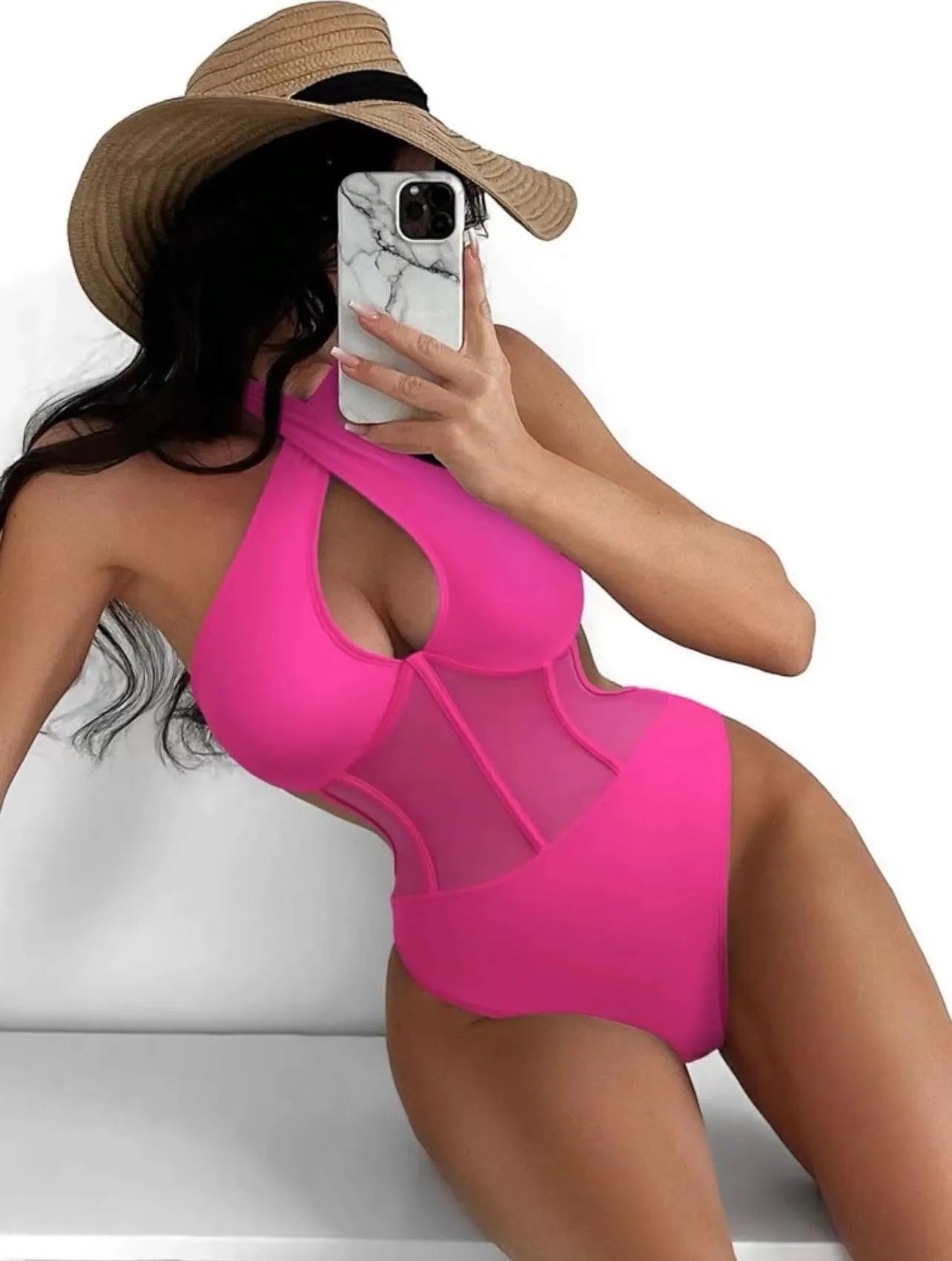 A woman's one-piece swimsuit bikini in a nylon and spandex blend, shown in black, rose red, and green colour options.