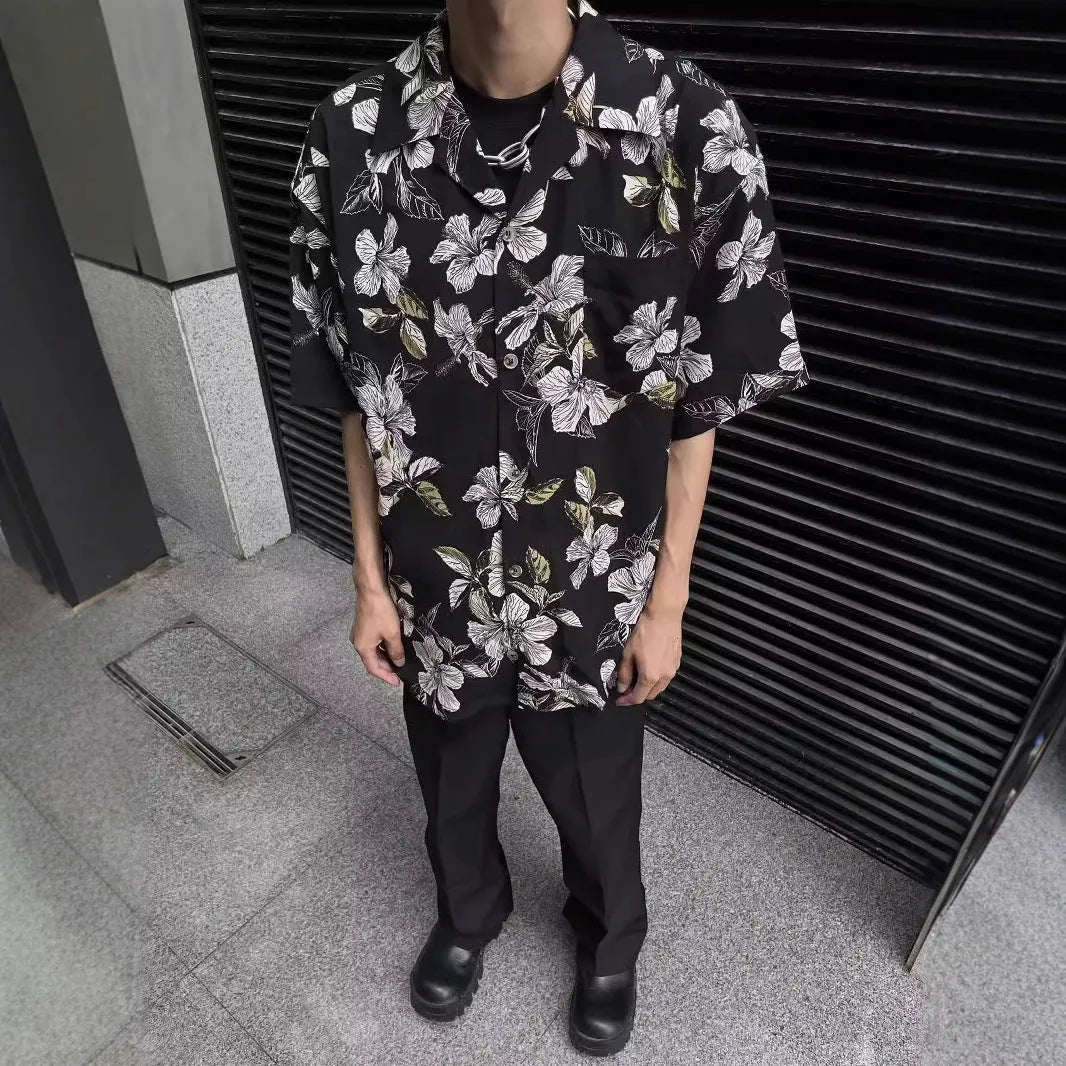 Black floral print vintage Cuban collar ice silk shirt with short sleeves on hanger