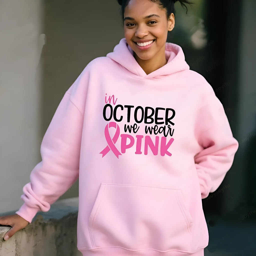 Retro graphic 'I'm A Survivor' slogan pullover hoodie with side seam pockets in pink colour.