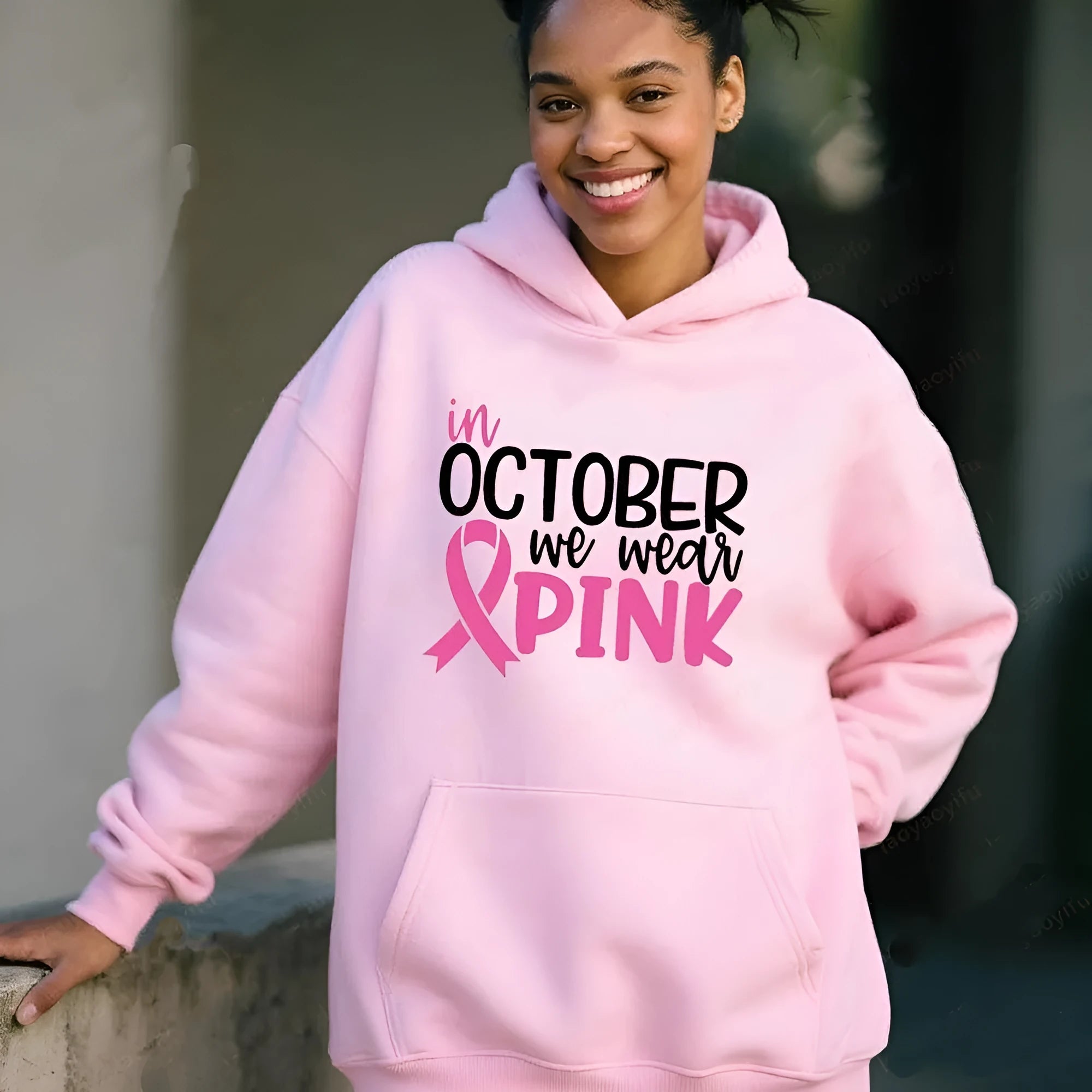 Retro graphic 'I'm A Survivor' slogan pullover hoodie with side seam pockets in pink colour.