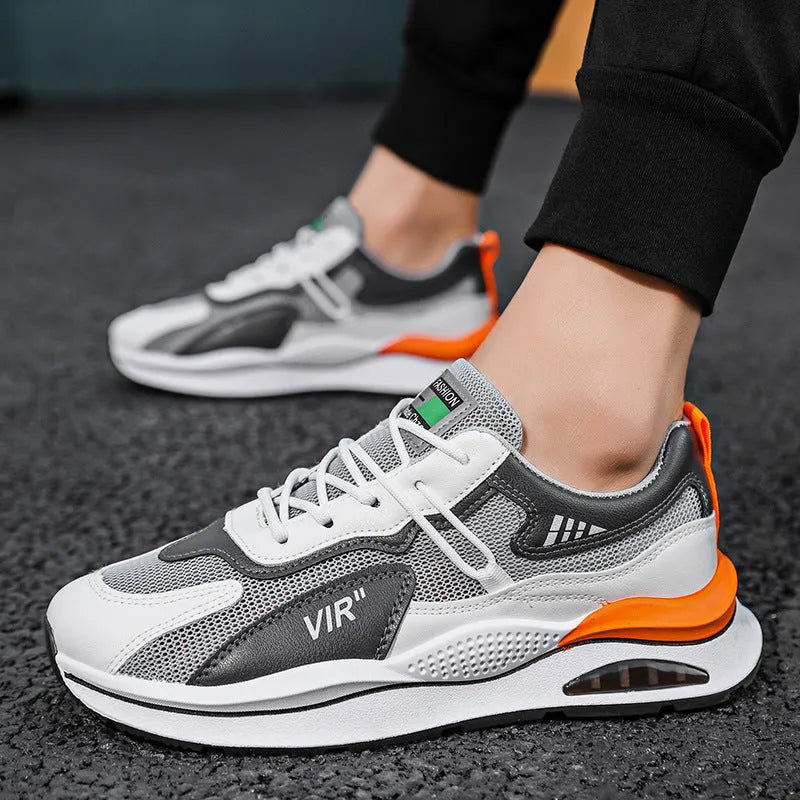 Men's gray breathable mesh running shoes with a round toe and casual sewing thread details on a white background.