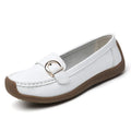 Women's beige loafers with round toe and flat heel on a light background