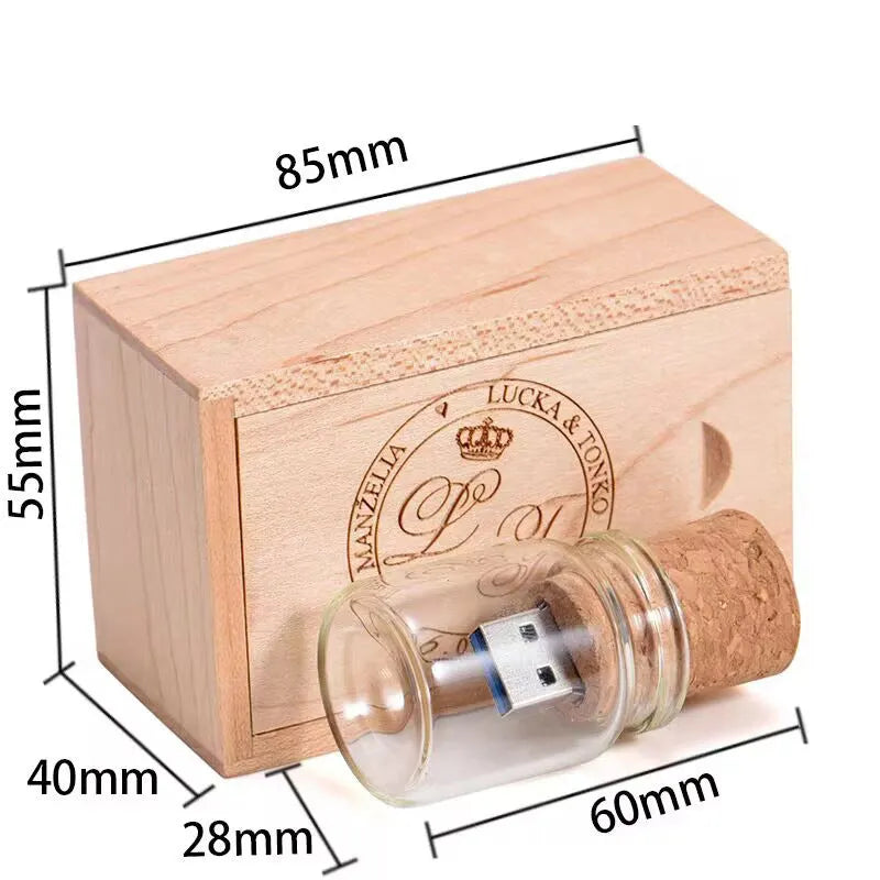 Wooden-capped transparent glass bottle USB flash drive on a wooden surface.