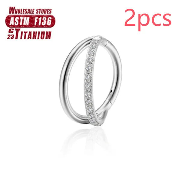 Titanium alloy nose ring in silver, available in plain or diamond-set styles and multiple lengths.