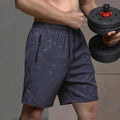 Men's loose-fit casual sports shorts in polyester, shown in black, blue, and grey colour options.