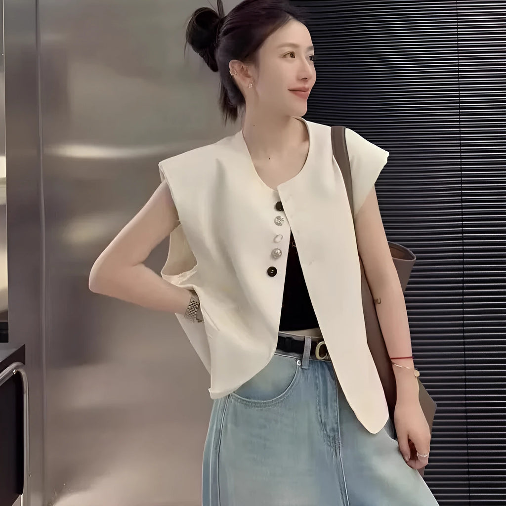 Women's loose fit polyester vest in milky white with pocket detail and 40cm length