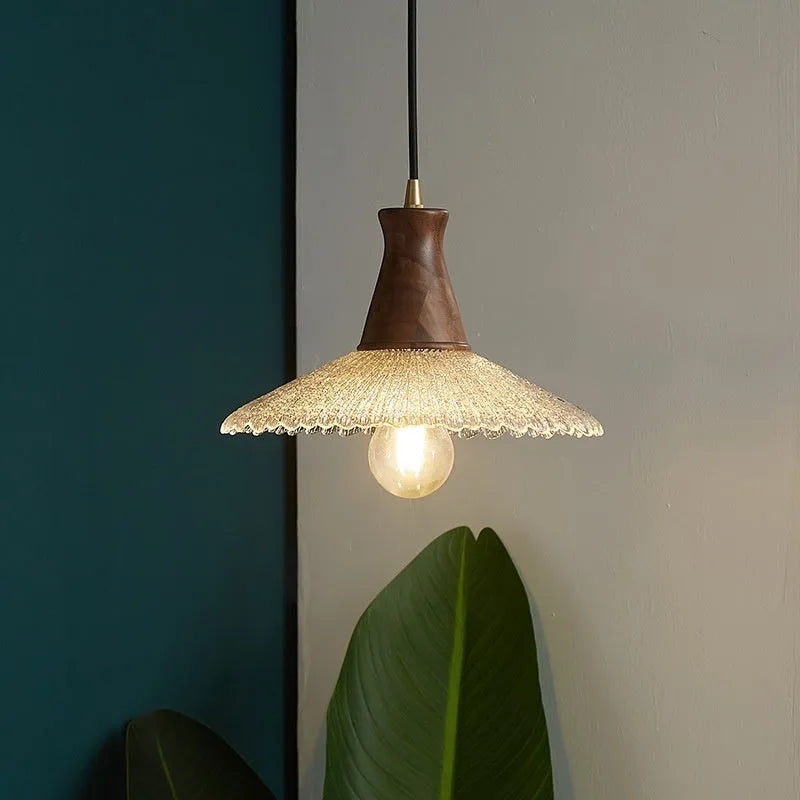 Retro-style brass and glass chandelier with wood body for ceiling mounting in restaurants.