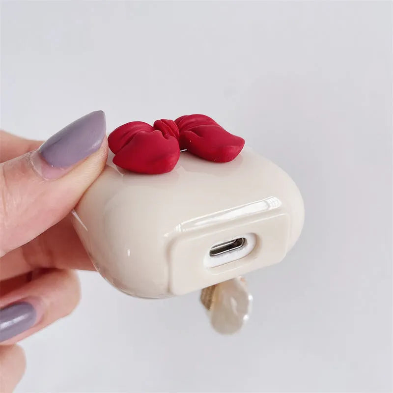 Beige red tpu protective case for AirPods Pro with a bow design on the shell.