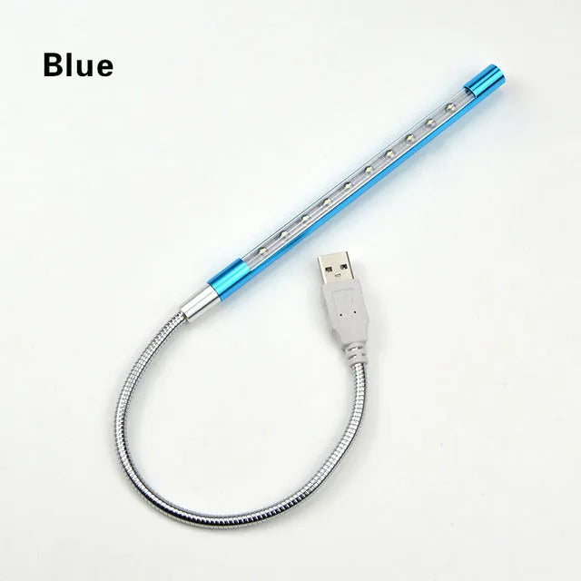 Spiral-shaped USB LED night light in metallic finish with aluminium alloy shade and metal base.