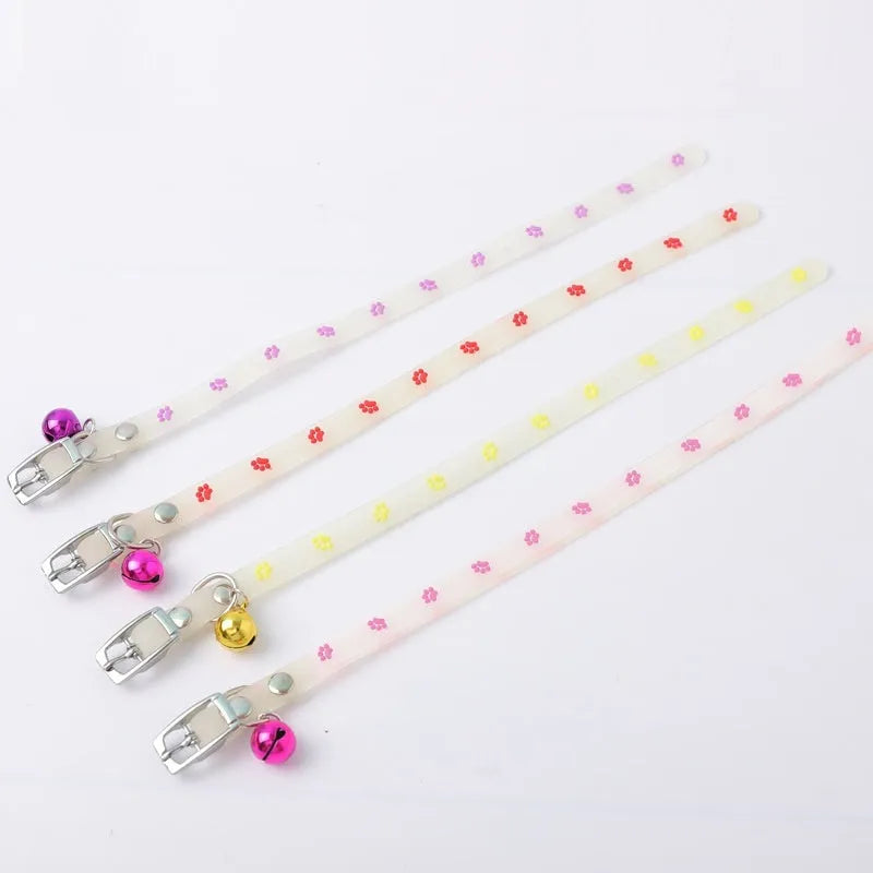 Glow in the dark cat collar with adjustable chain in paw print, love, fishbone, or footprint design.