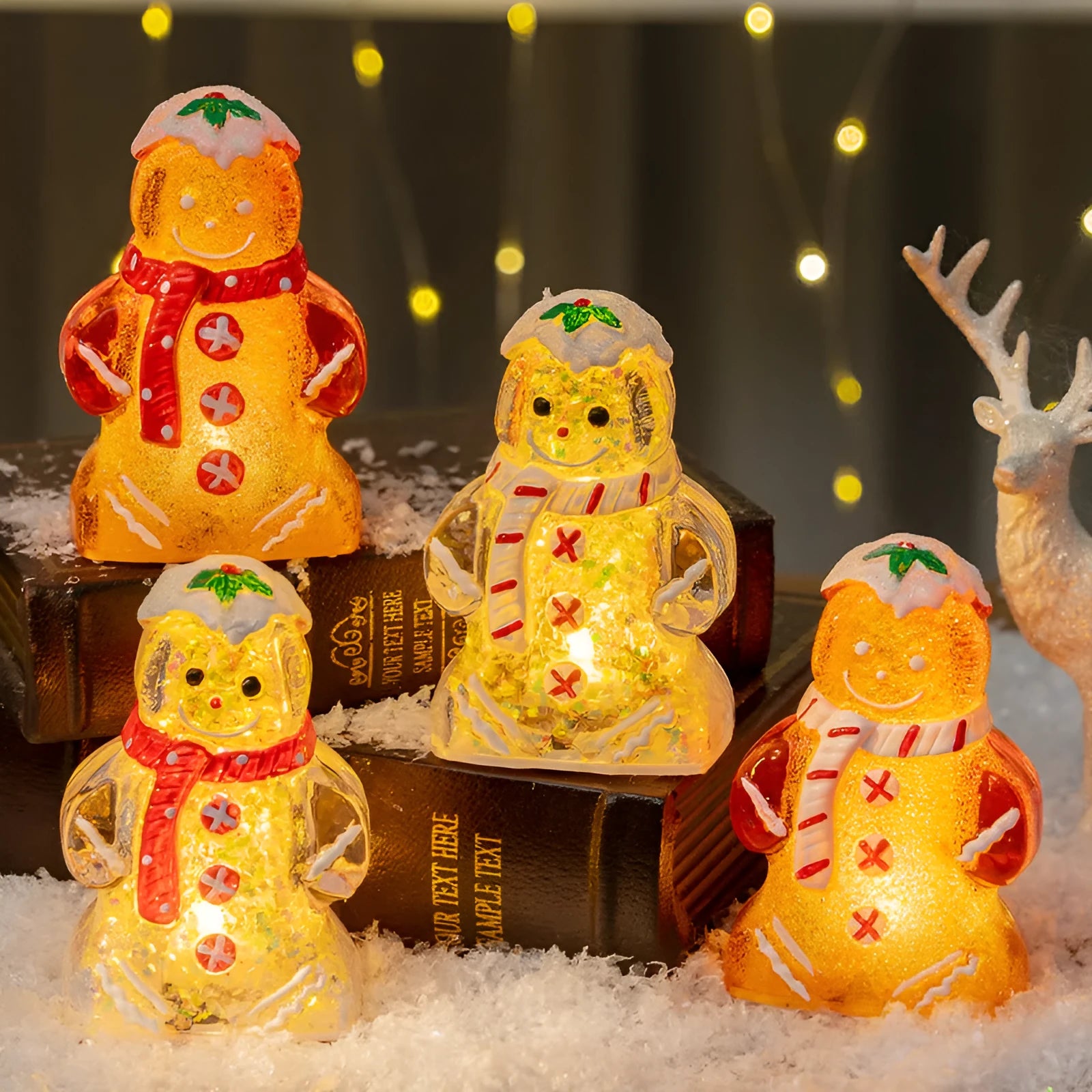 Set of four glowing Christmas gingerbread man and snowman ornaments with different coloured scarves on a festive background.