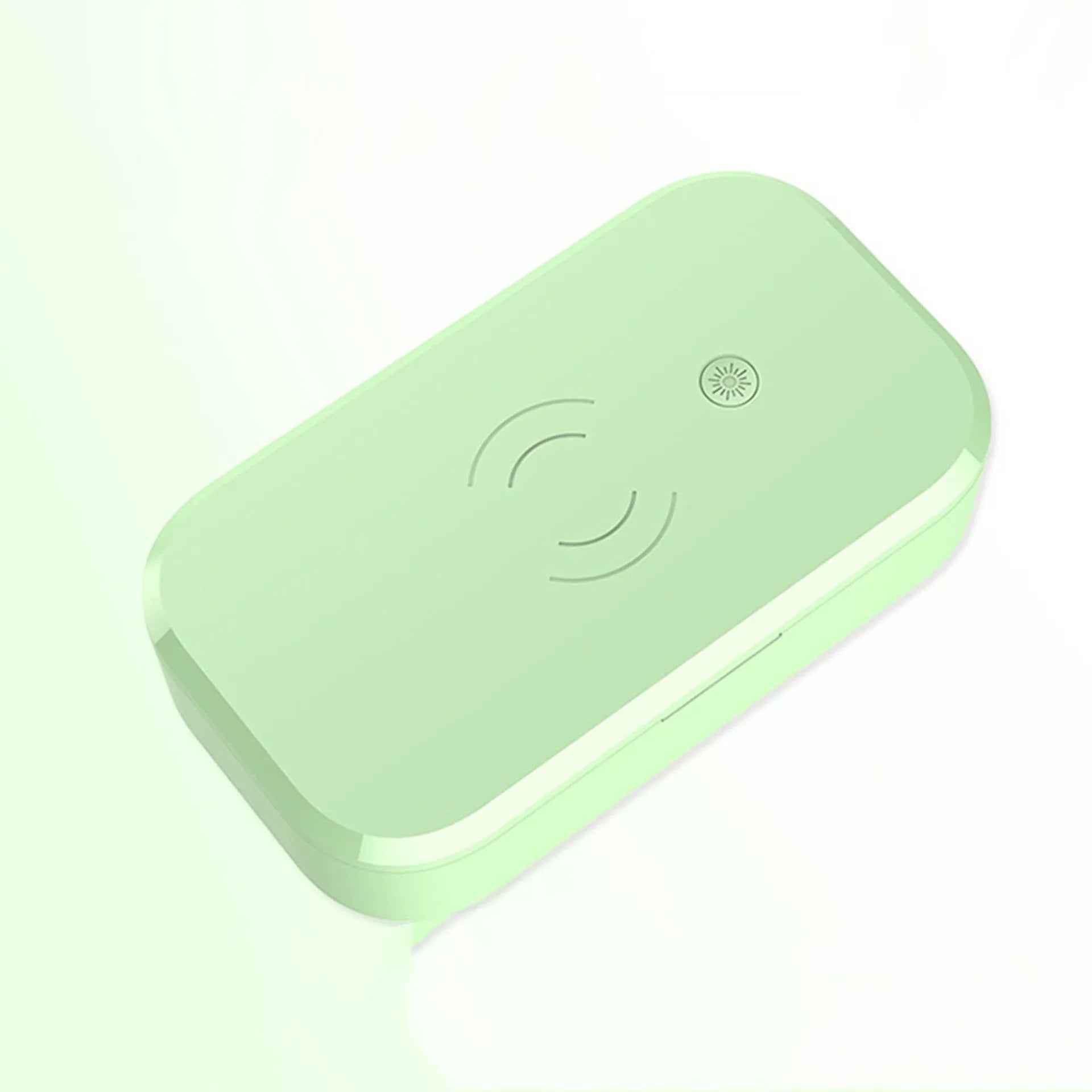 White ultraviolet disinfection box with wireless charging pad inside for phones and beauty tools.