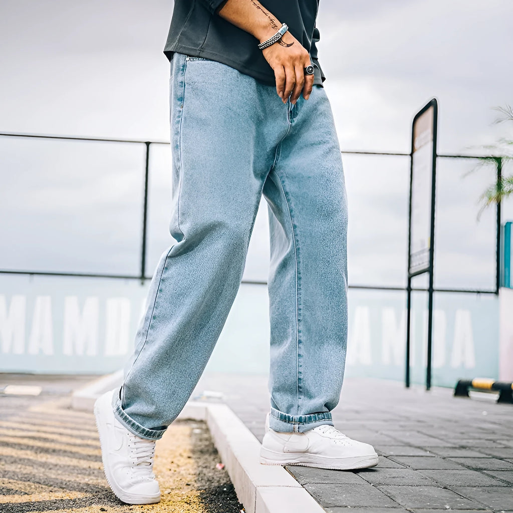 Men's loose straight casual jeans in dark blue, light blue and grey colours with mid waist design