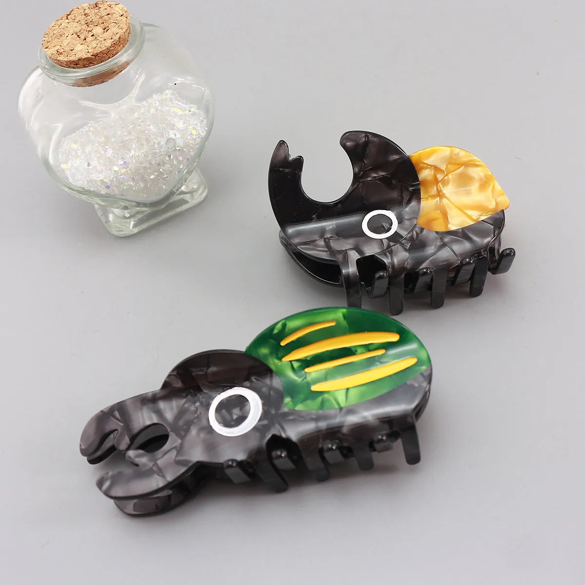 Handmade cellulose acetate insect biology beetle grip with cartoon beetle and caterpillar designs
