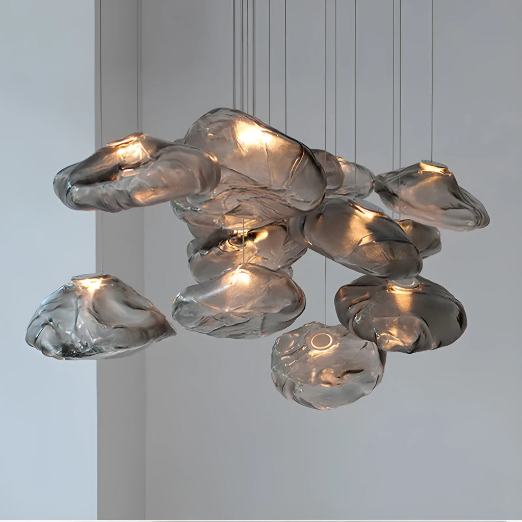 Modern fabric chandelier with glass shade shown in small and large sizes with clear, amber, and smoke grey light options.