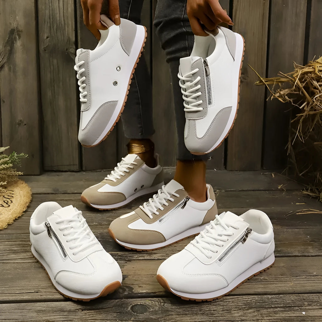 Women's flat-heeled casual shoes in champagne, grey, and white colours with artificial PU upper.