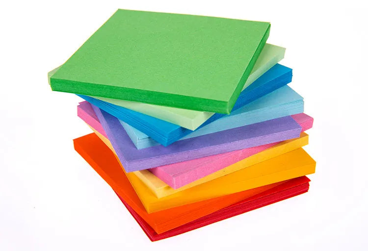 Assorted colourful scroll-style paper notes with metal eyelets in four different sizes.