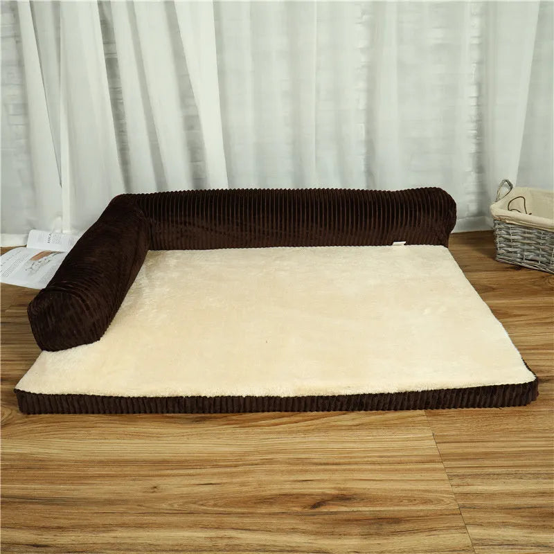 Corduroy dog sofa bed in grey, showing high sides and non-slip base, placed on a wooden floor.