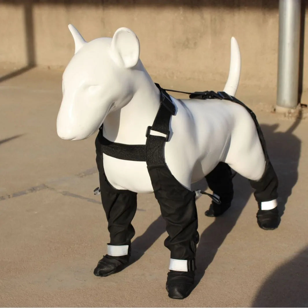 Black waterproof dog shoes with non-slip soles and an adjustable strap closure.