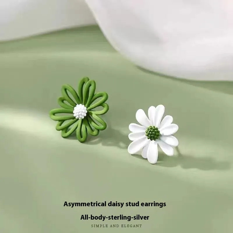A pair of cartoon-style flower stud earrings in alloy, showing a blue and orange two-tone colour variant.