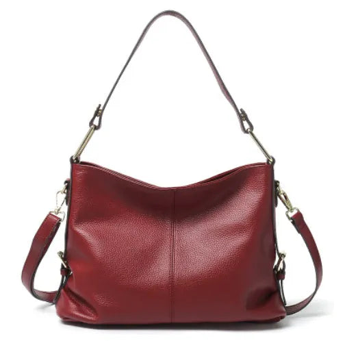 Genuine leather vertical square crossbody bag showing internal zipper compartments and external sandwich pocket