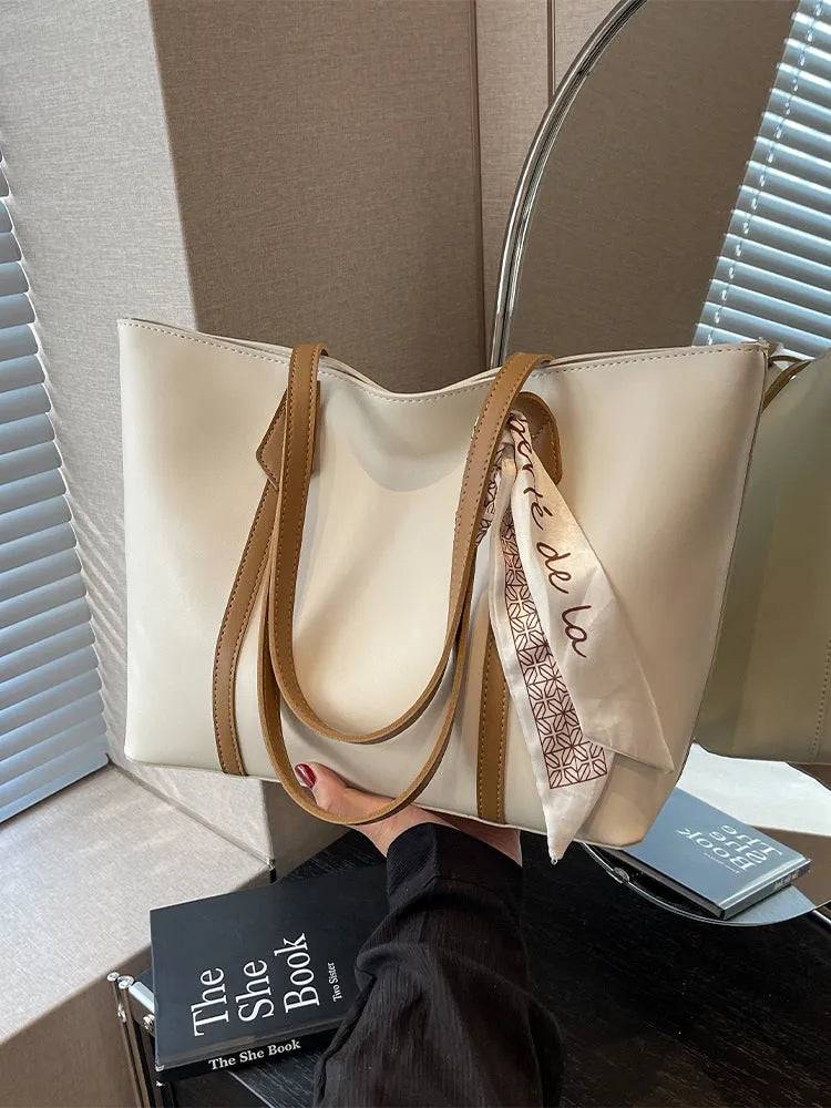 Large capacity bucket tote bag with soft construction and sandwich pocket design