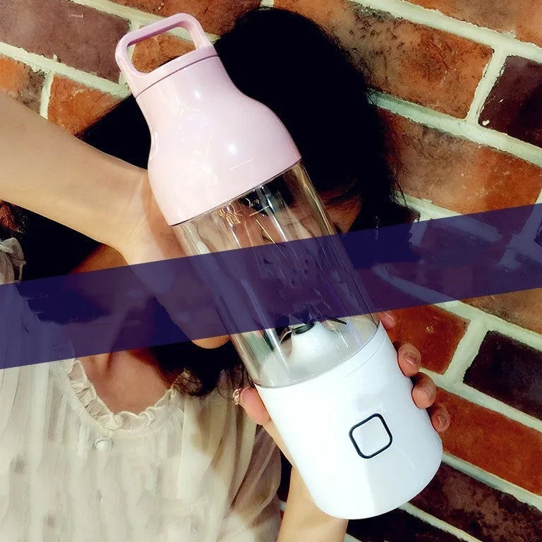 Portable mini juice cup blender with 180W motor and high borosilicate glass liner in pink on a white surface