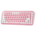 Pink dual-mode wireless Bluetooth mute portable keyboard with 84 keys and ABS construction on a desk