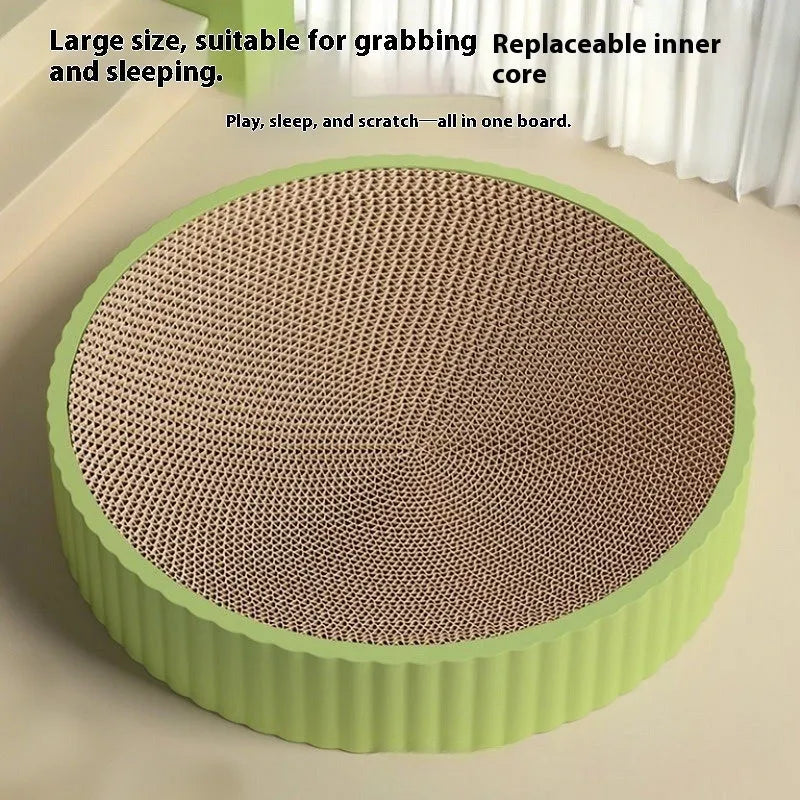 Green and white round cat scratching board with corrugated paper centre measuring 55 cm diameter