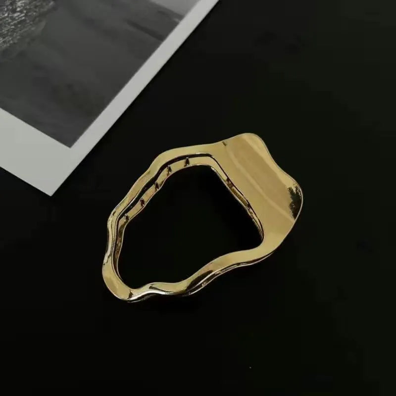 Women's zinc alloy hair barrettes in gold and silver with arc, square, and triangle shapes