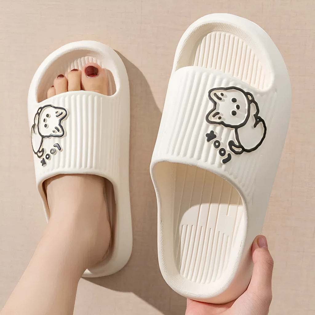 Green EVA platform flip flop slippers with a raised cat design on the upper.