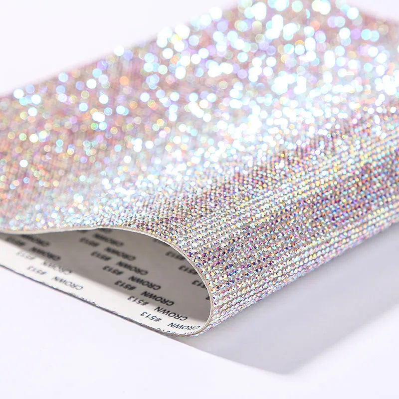 Rhinestone sticker sheet with hot drill glue backing showing eight-eye pattern stones in multiple colours