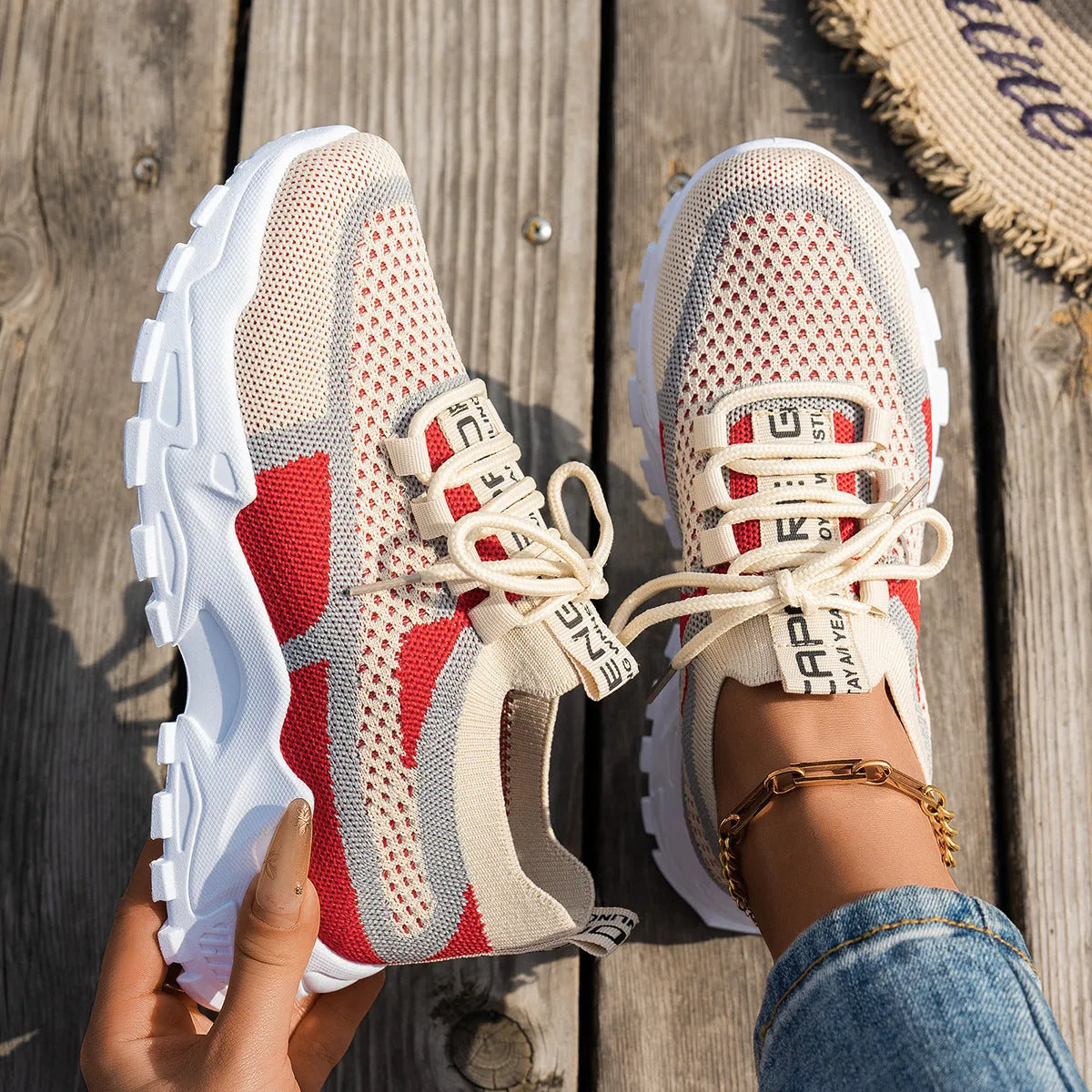 Women's Flyknit mesh lace-up sneakers in grey and white colourway
