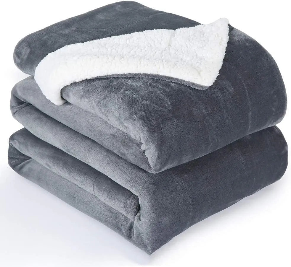 Grey and white USB electric heating blanket with intelligent temperature control on a sofa.