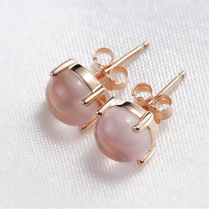 Women's rose gold drop-shaped stud earrings with synthetic Ross quartz and crystal inlay detail