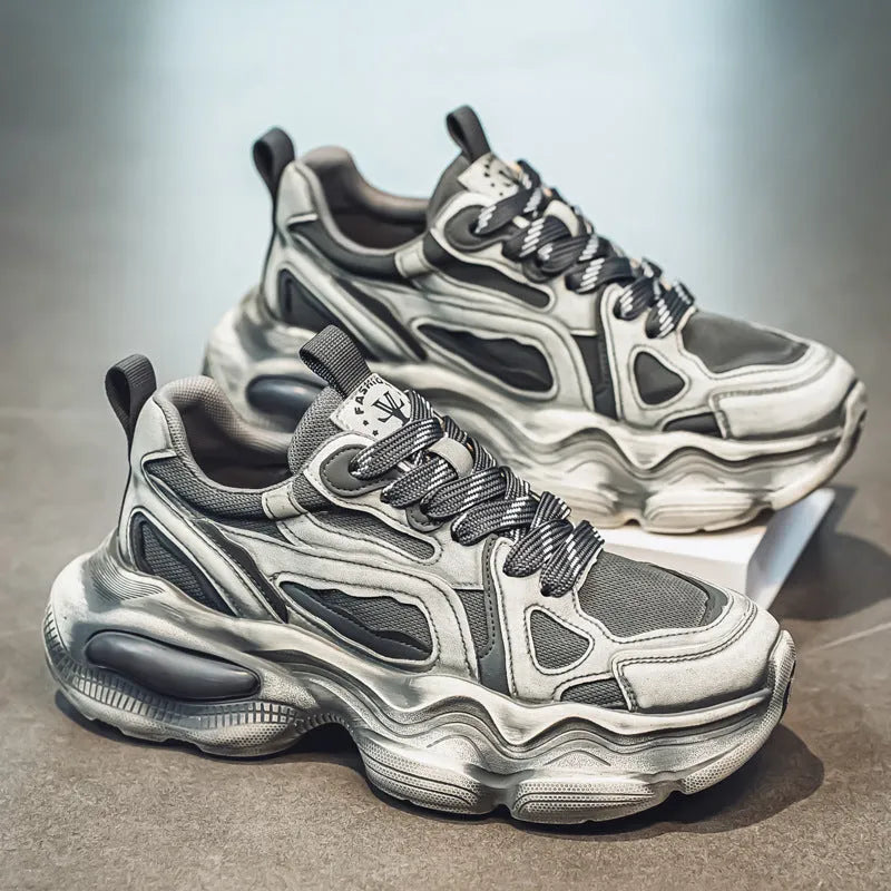 Men's black mesh sneakers with brush colour pattern, platform heel, and lace-up front.
