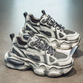Men's black mesh sneakers with brush colour pattern, platform heel, and lace-up front.