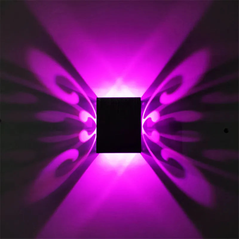 Modern aluminium LED butterfly wall lamp with remote control for seven colour options on interior wall