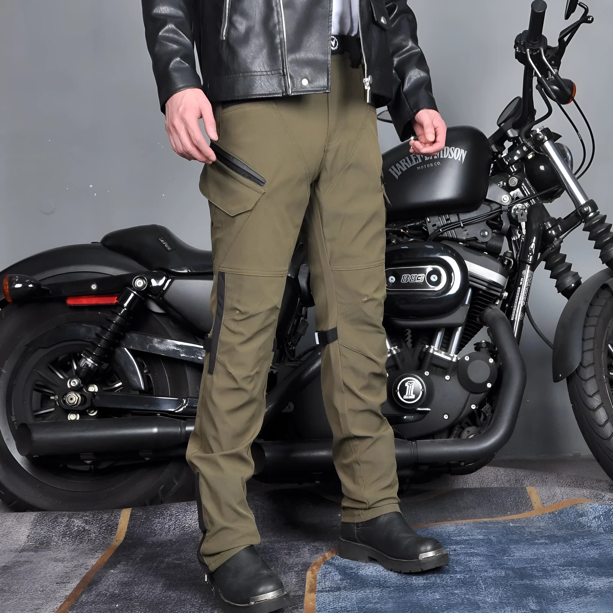 Men's black and green waterproof motorcycle cycling trousers with detachable protective gear set.